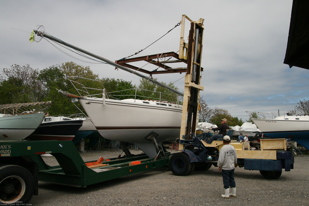 Mast on, mast off for the ride to the harbor  ~~  Launch 2011