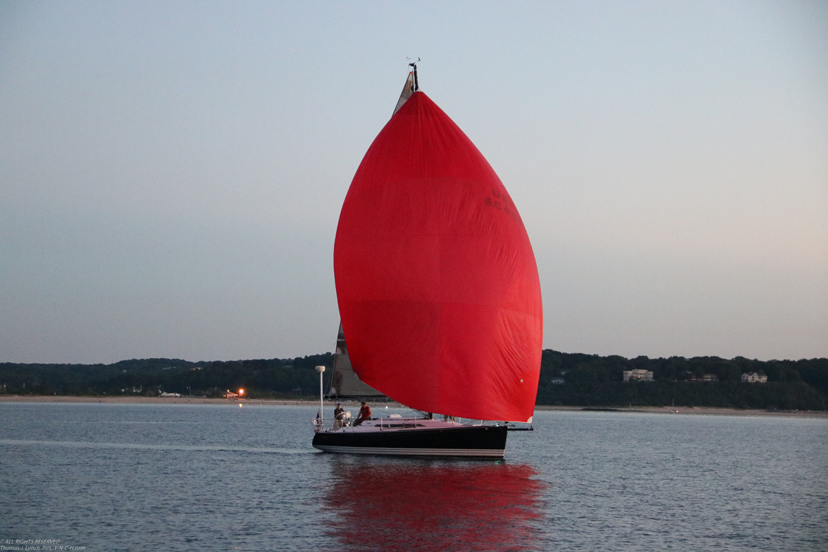 Kathryn with the kite up  ~~  (we are gonna trade boat for boat someday, they have not quite agreed yet)